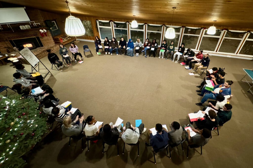 Participants gathered during a plenary session at the camp.