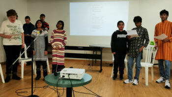 A newly formed junior youth group sings a song from a lesson in the text "Breezes of Confirmation."